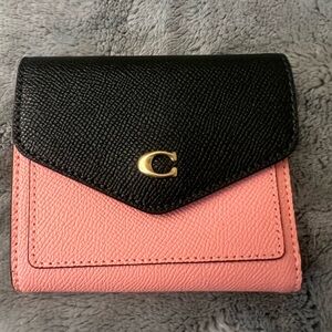 Pink and dark green wallet by Coach